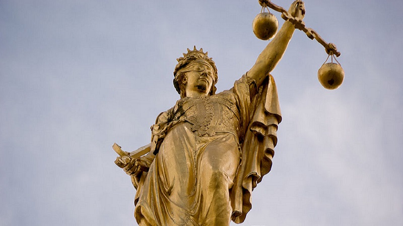 Statue of golden lady justice in Bruges, Belgium